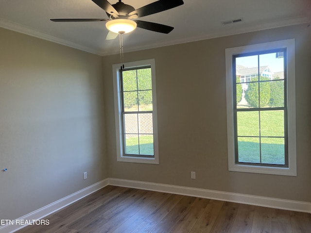 unfurnished room featuring a wealth of natural light, ceiling fan, and dark wood-type flooring