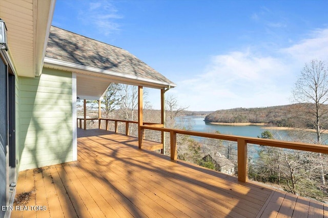 wooden deck featuring a water view