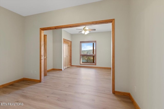 spare room with ceiling fan and light hardwood / wood-style flooring