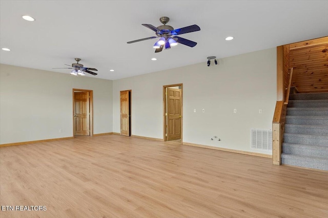 unfurnished room with ceiling fan and light hardwood / wood-style flooring