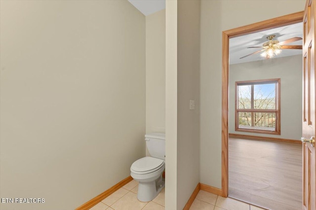 bathroom with tile patterned floors, toilet, and ceiling fan