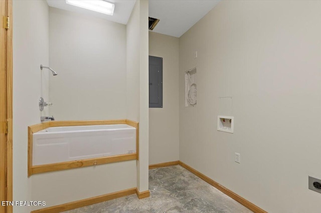 bathroom with concrete floors, electric panel, and a bathing tub