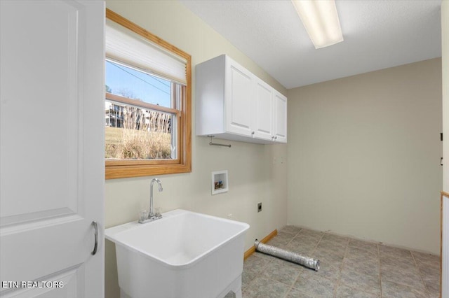 laundry area featuring washer hookup, sink, cabinets, and hookup for an electric dryer