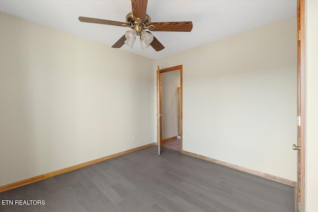 empty room with ceiling fan and dark wood-type flooring