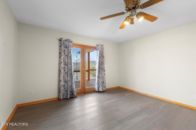 empty room featuring hardwood / wood-style floors and ceiling fan