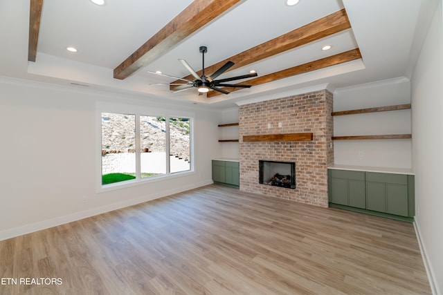 unfurnished living room featuring a fireplace, light wood-type flooring, and baseboards