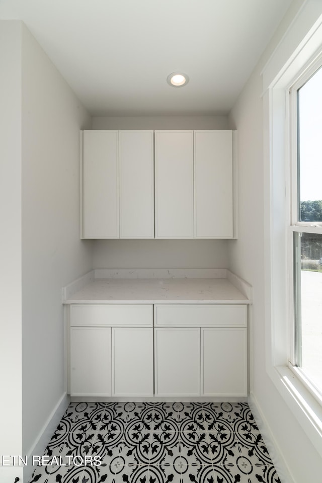 office area with recessed lighting, baseboards, and light tile patterned flooring