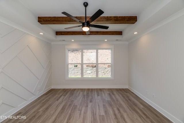 unfurnished room with ceiling fan, baseboards, beam ceiling, recessed lighting, and wood finished floors