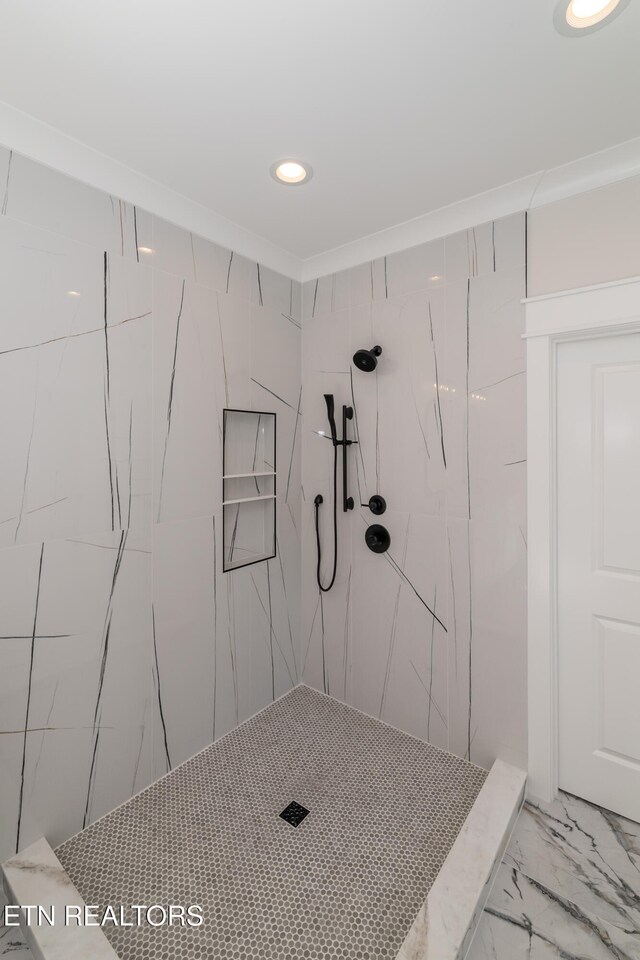 full bath with a marble finish shower, recessed lighting, marble finish floor, and ornamental molding