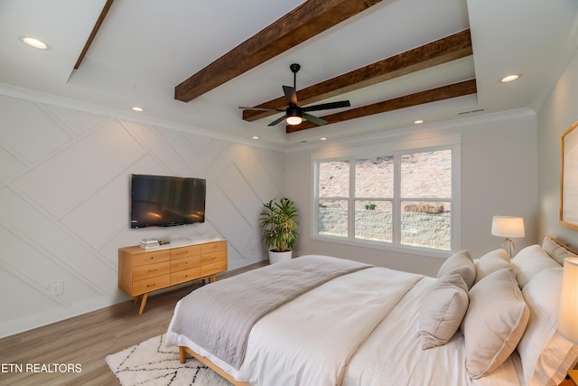 bedroom with beam ceiling, recessed lighting, light wood-style floors, and ornamental molding