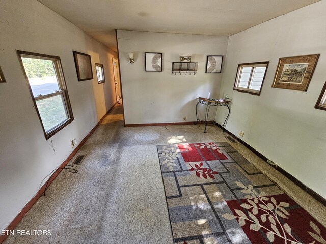 empty room featuring dark colored carpet