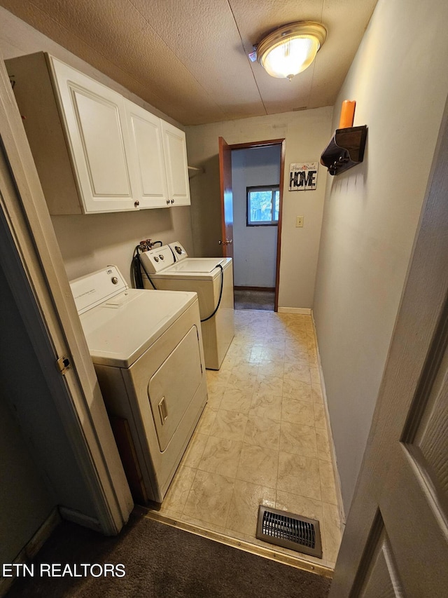 600 W 7th Ave, Lenoir City, TN 37771 - washroom featuring a textured ceiling, baseboards, visible vents, washer and dryer, and cabinet space