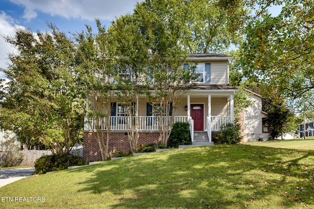 view of front of home featuring a front lawn and a porch