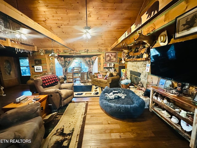 living room featuring wood ceiling, a fireplace, hardwood / wood-style floors, and ceiling fan