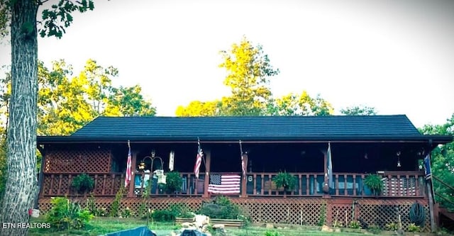 rear view of property with a deck