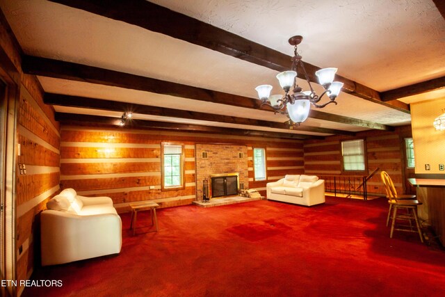 sitting room featuring carpet, a brick fireplace, a chandelier, and beamed ceiling