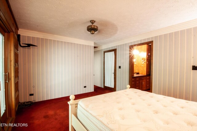 bedroom featuring dark carpet, a textured ceiling, connected bathroom, and ceiling fan