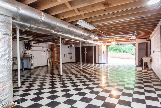 basement with water heater and sink