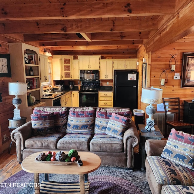 living room featuring wooden ceiling, beam ceiling, wooden walls, dark hardwood / wood-style floors, and sink