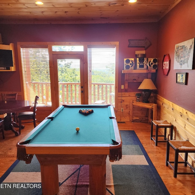 recreation room featuring wooden ceiling, wooden walls, light hardwood / wood-style flooring, and billiards