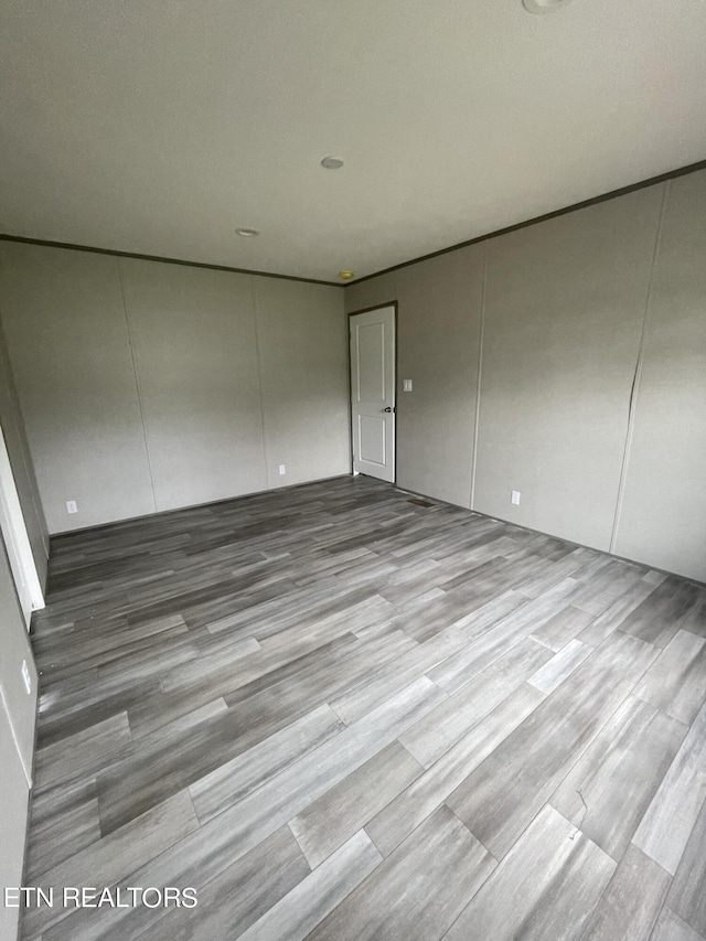 spare room featuring light wood-type flooring