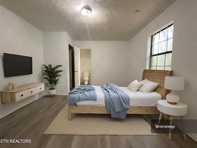 bedroom with dark wood-type flooring