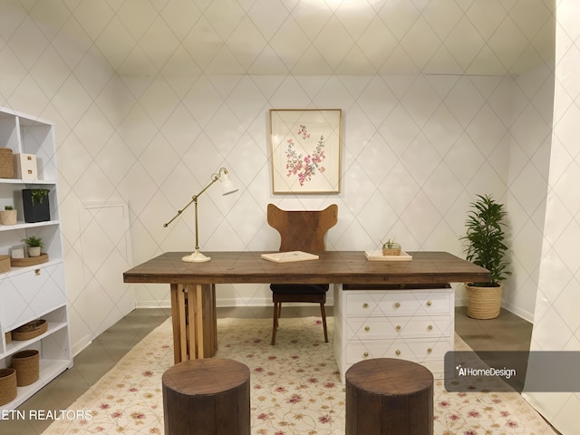 office area featuring dark tile patterned flooring and tile walls