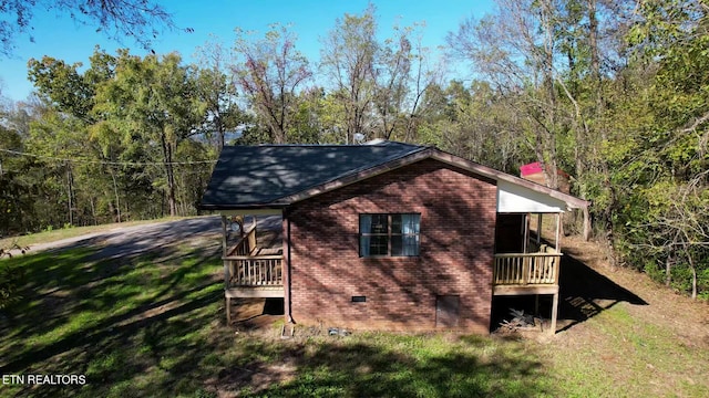 view of home's exterior with a yard