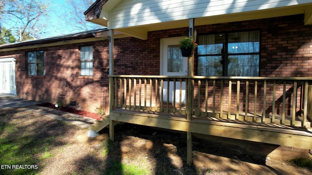 exterior space featuring a wooden deck