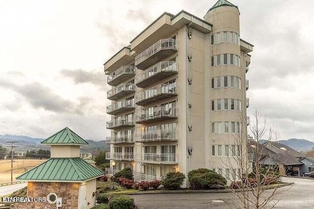 view of building exterior featuring a mountain view