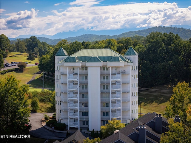 view of building exterior featuring a mountain view