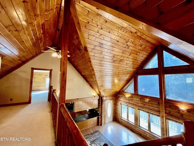 additional living space featuring wooden ceiling, vaulted ceiling, and ceiling fan