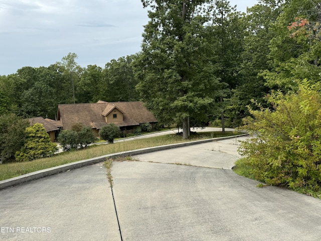 view of front of property with a view of trees