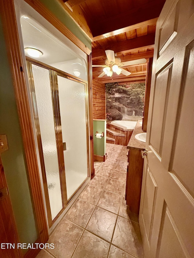 full bathroom featuring a shower stall, a ceiling fan, vanity, wooden walls, and wooden ceiling