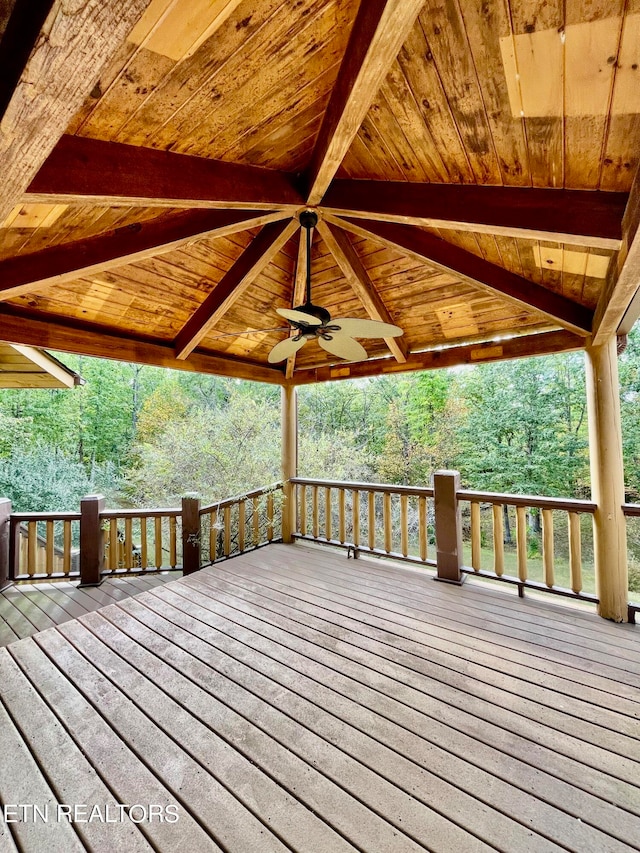 wooden deck featuring ceiling fan