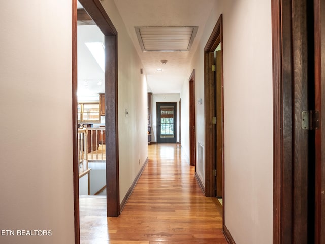 hall with light wood-type flooring