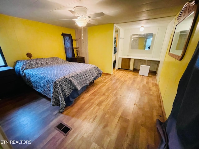 bedroom with ceiling fan and light wood-type flooring