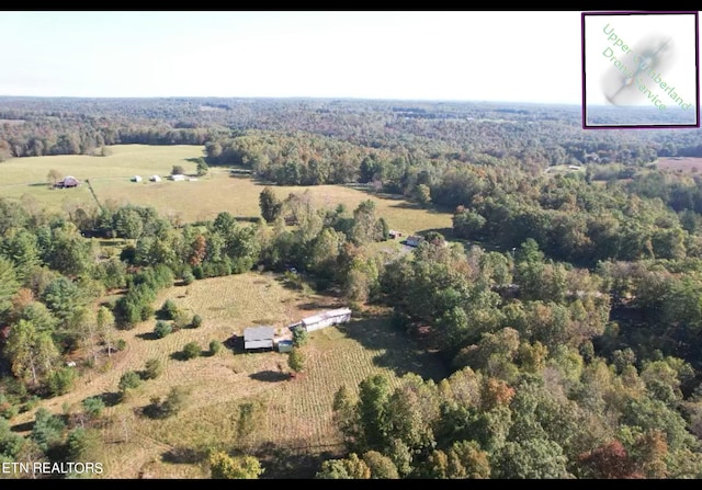 birds eye view of property with a rural view