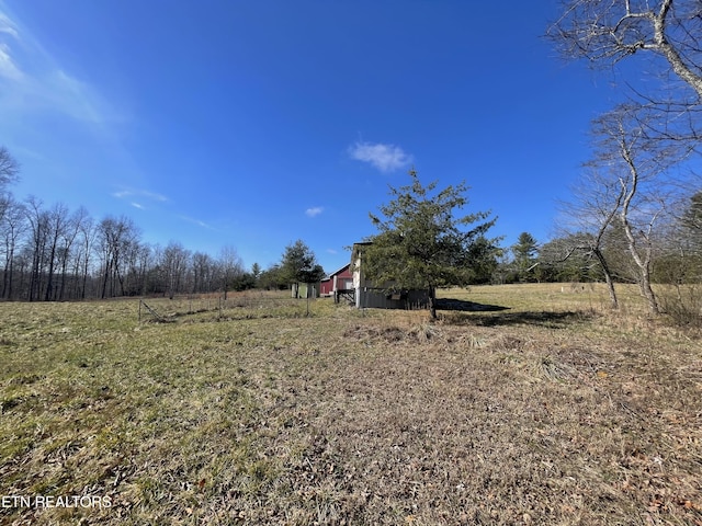 view of yard with a rural view