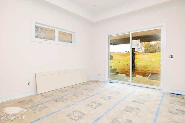 empty room featuring crown molding