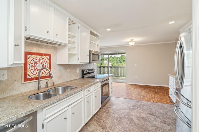 kitchen with appliances with stainless steel finishes, white cabinetry, and sink