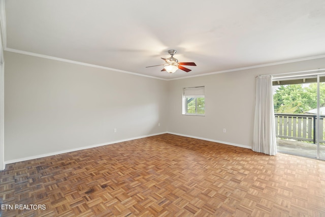 spare room featuring crown molding, ceiling fan, and parquet flooring