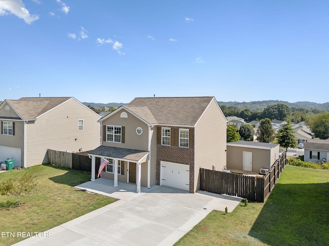 view of front of house featuring a front yard and a garage