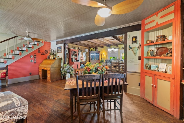 dining space with stairs, wood finished floors, and ceiling fan with notable chandelier