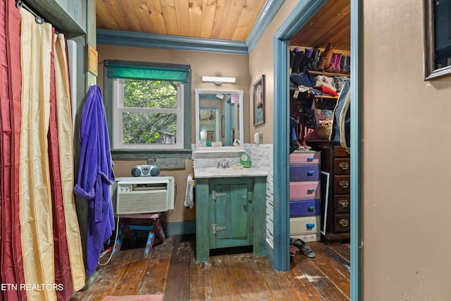 bathroom featuring a wall mounted AC, wood ceiling, hardwood / wood-style flooring, vanity, and ornamental molding