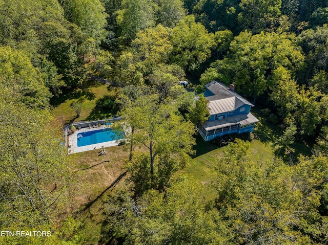 aerial view featuring a view of trees