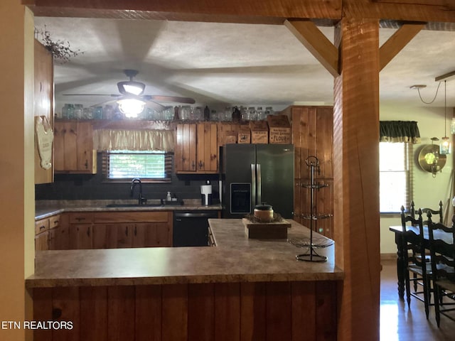 kitchen featuring stainless steel fridge with ice dispenser, a sink, ceiling fan, dishwasher, and brown cabinetry