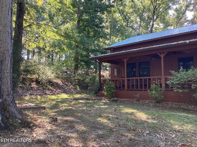 view of yard with covered porch