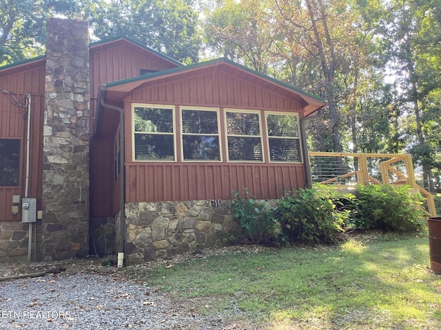 view of property exterior with a lawn