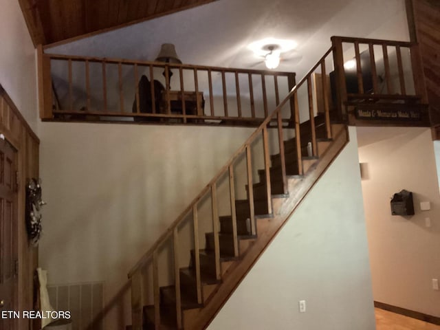 stairs featuring baseboards and visible vents
